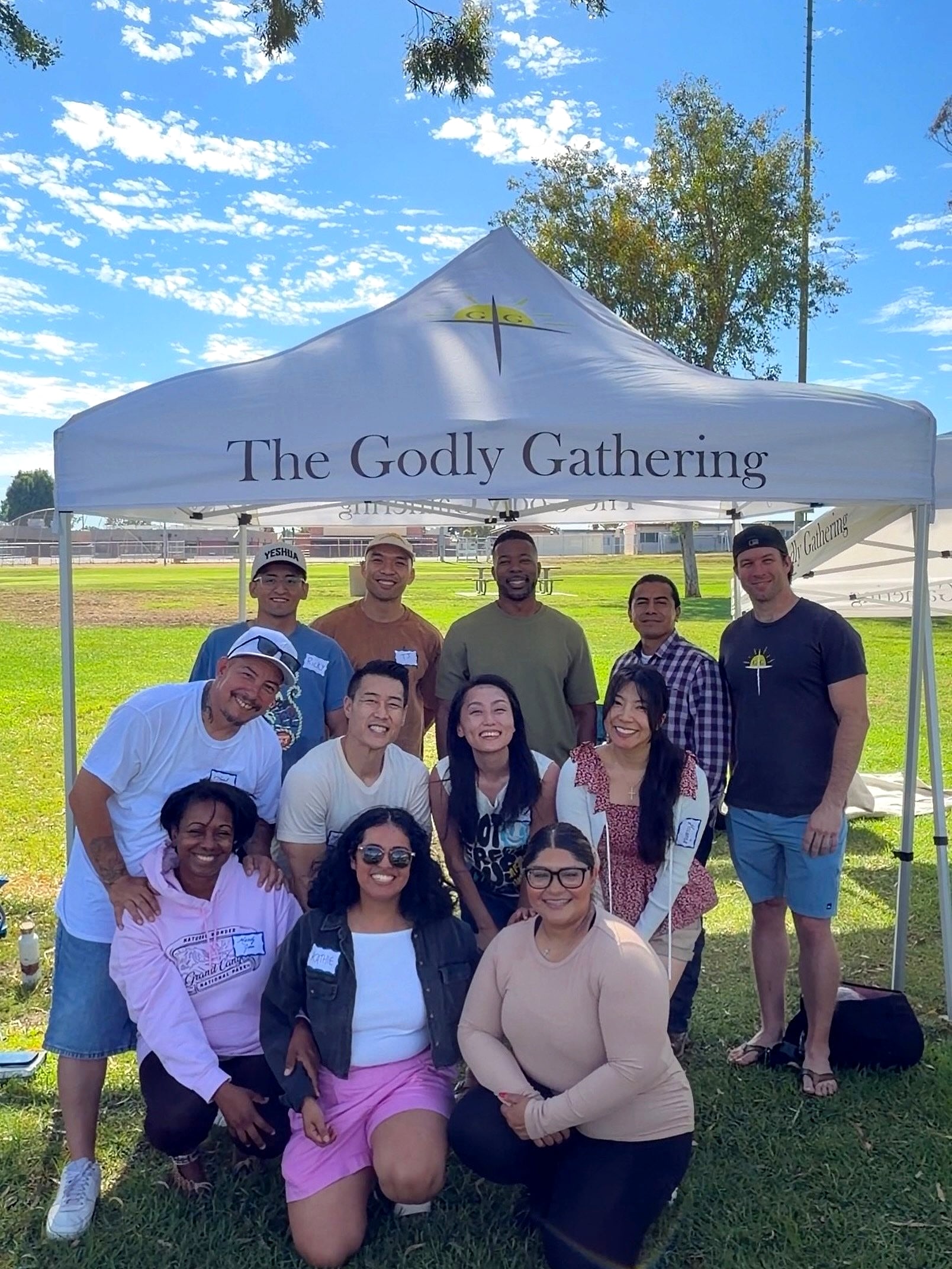 The group under The Godly Gathering canopy in Brea