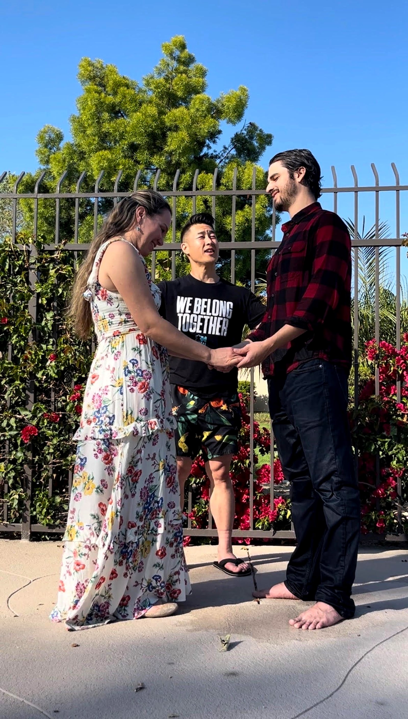 An outdoor ceremony with a bride and groom