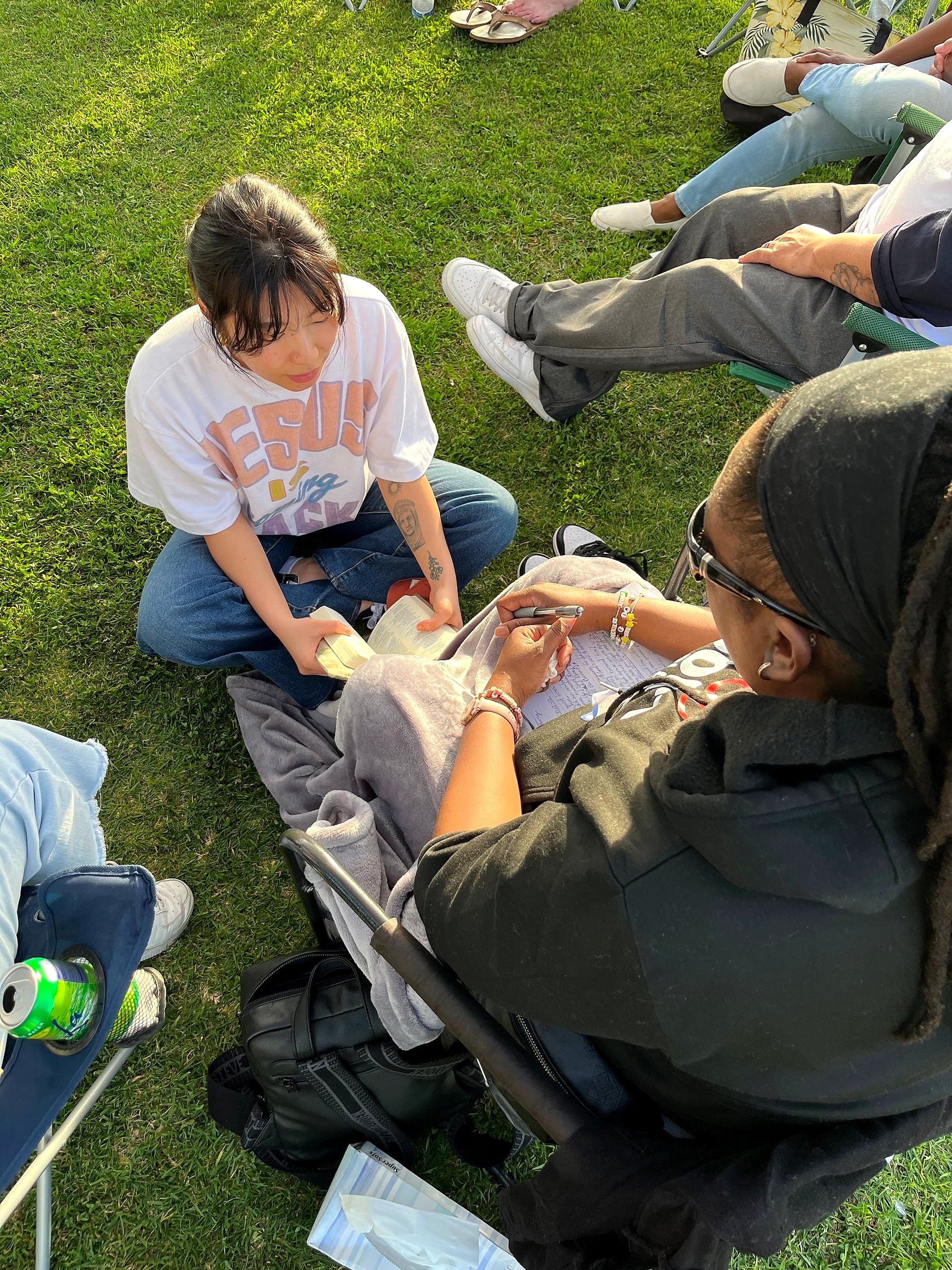 Women sitting on the grass talking